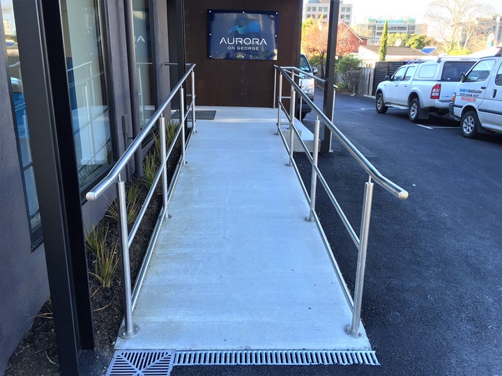 Stainless steel hand rail on access ramp