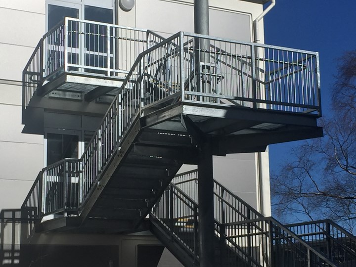 New galvanised steel egress stair with stainless handrails